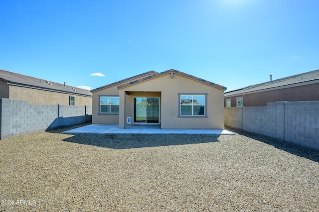 back of house with a patio area