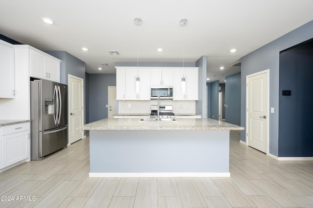 12568 W Orangewood Ave, Glendale, AZ 85307 - kitchen featuring visible vents, an island with sink, white cabinetry, a sink, and stainless steel appliances