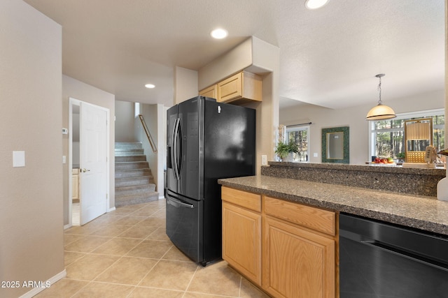 4435 E Savannah Cir, Flagstaff, AZ 86004 - kitchen with light brown cabinetry, dark countertops, baseboards, black fridge with ice dispenser, and dishwasher