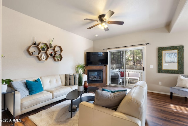 4435 E Savannah Cir, Flagstaff, AZ 86004 - living room featuring a glass covered fireplace, baseboards, wood finished floors, and ceiling fan
