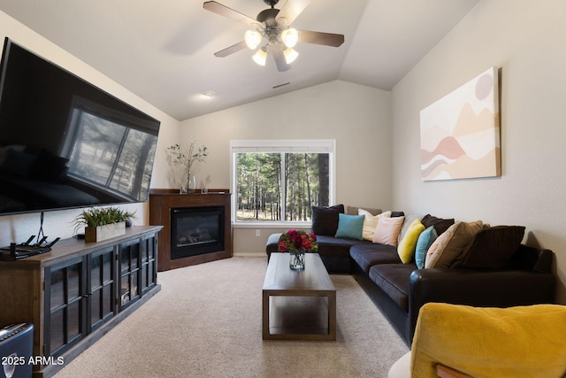 4435 E Savannah Cir, Flagstaff, AZ 86004 - living area featuring vaulted ceiling, a glass covered fireplace, ceiling fan, carpet, and visible vents