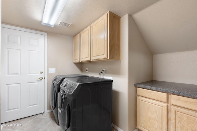 4435 E Savannah Cir, Flagstaff, AZ 86004 - washroom with washer and clothes dryer, a textured ceiling, light tile patterned flooring, cabinet space, and visible vents