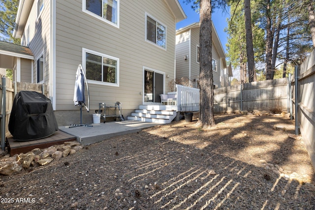 4435 E Savannah Cir, Flagstaff, AZ 86004 - rear view of house featuring a fenced backyard, a wooden deck, and a patio area