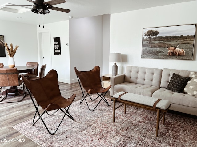 living room with hardwood / wood-style floors and ceiling fan