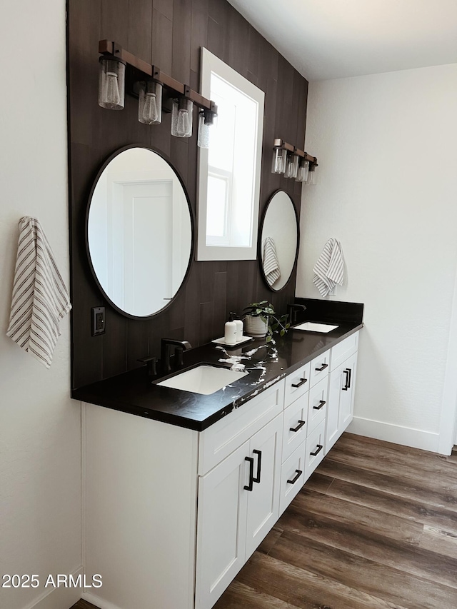 bathroom with hardwood / wood-style flooring and vanity