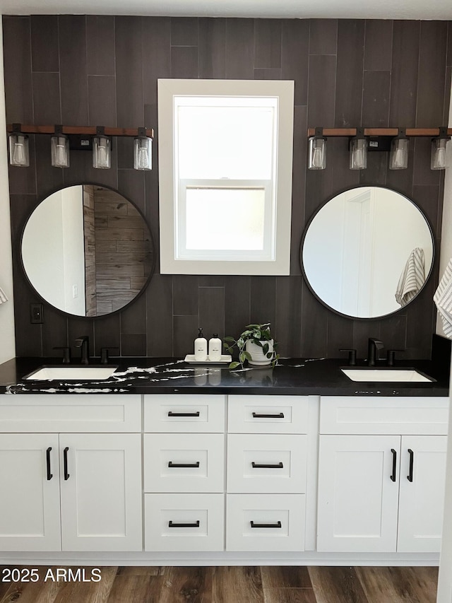 bathroom featuring hardwood / wood-style flooring and vanity