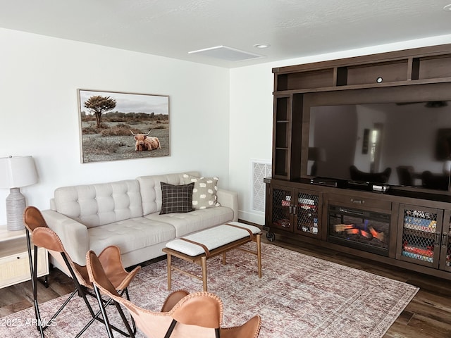 living room with dark hardwood / wood-style flooring