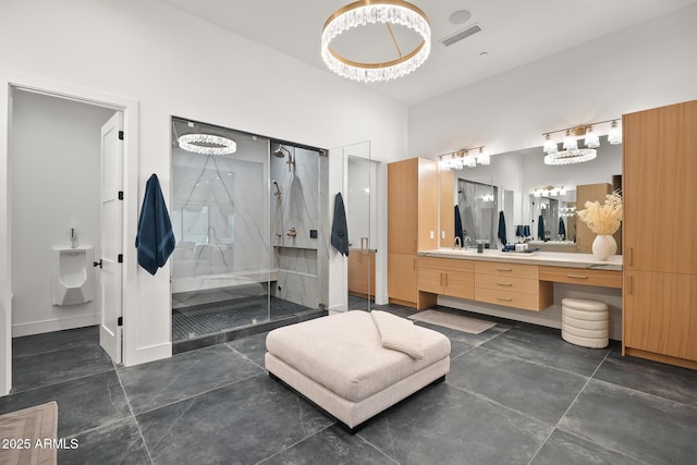 full bath featuring visible vents, baseboards, a stall shower, an inviting chandelier, and vanity