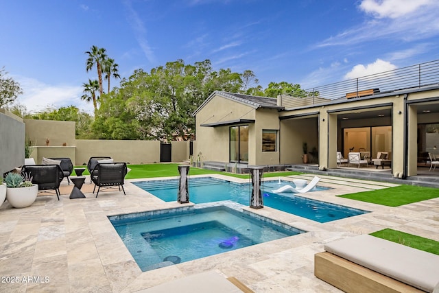 view of swimming pool with an outdoor living space, a fenced in pool, fence, a patio area, and an in ground hot tub