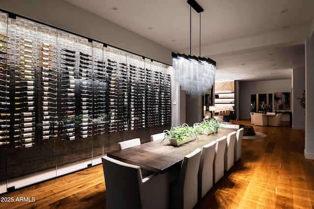 dining space featuring a city view and wood finished floors