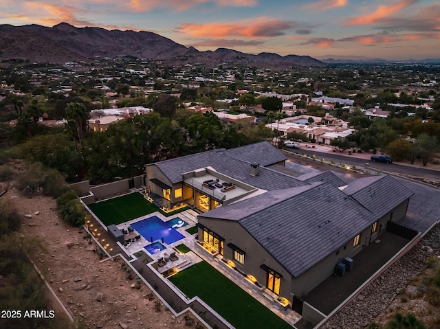 birds eye view of property featuring a mountain view