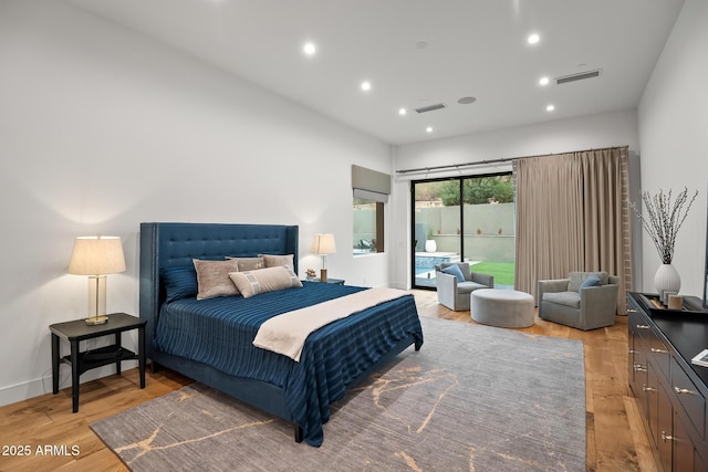 bedroom with access to outside, recessed lighting, light wood-style flooring, and visible vents