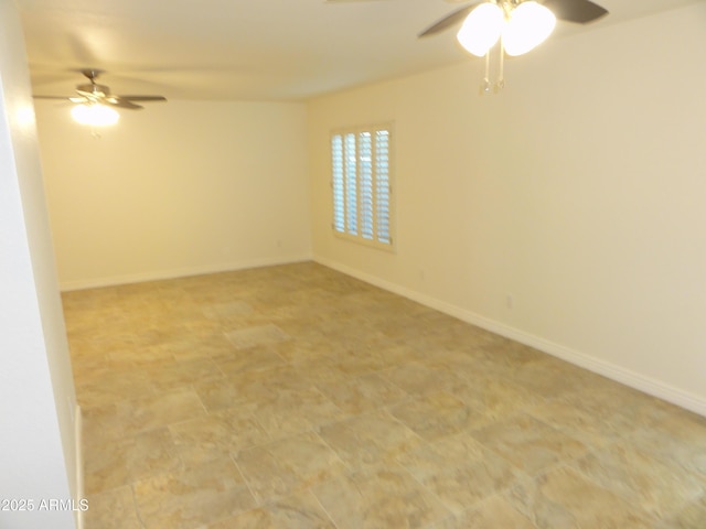 unfurnished room with baseboards and ceiling fan