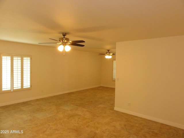 empty room featuring baseboards