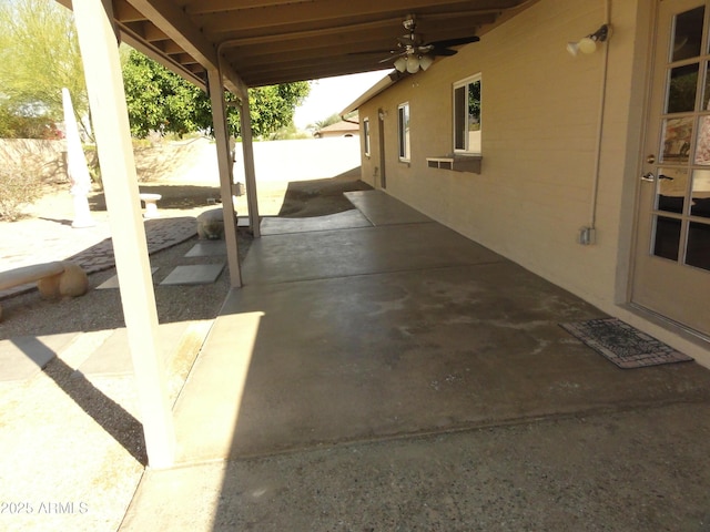 view of patio / terrace with fence and ceiling fan