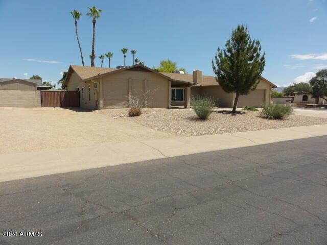 ranch-style house with stucco siding, concrete driveway, and a garage