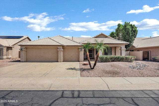 6368 W Firebird Dr, Glendale, AZ 85308 - view of front facade featuring a garage, stucco siding, driveway, and a tile roof