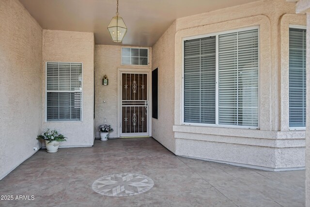6368 W Firebird Dr, Glendale, AZ 85308 - doorway to property with a patio and stucco siding