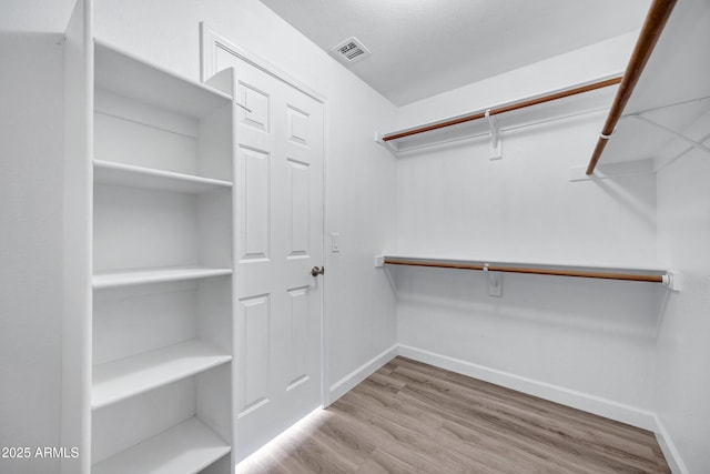 6368 W Firebird Dr, Glendale, AZ 85308 - walk in closet with wood finished floors