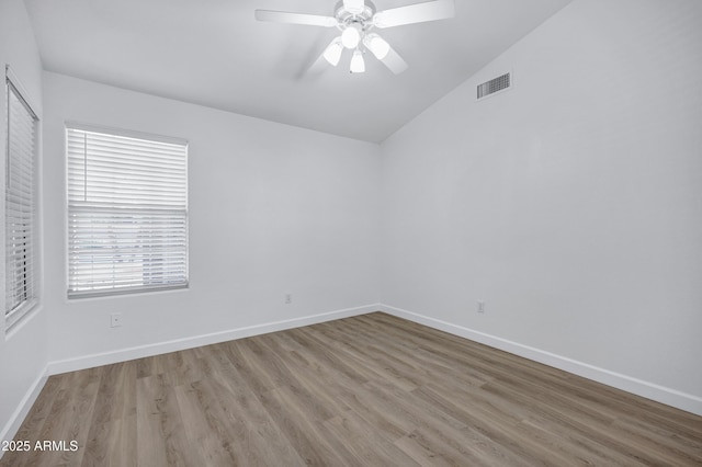 6368 W Firebird Dr, Glendale, AZ 85308 - unfurnished room with wood finished floors, vaulted ceiling, a ceiling fan, and baseboards