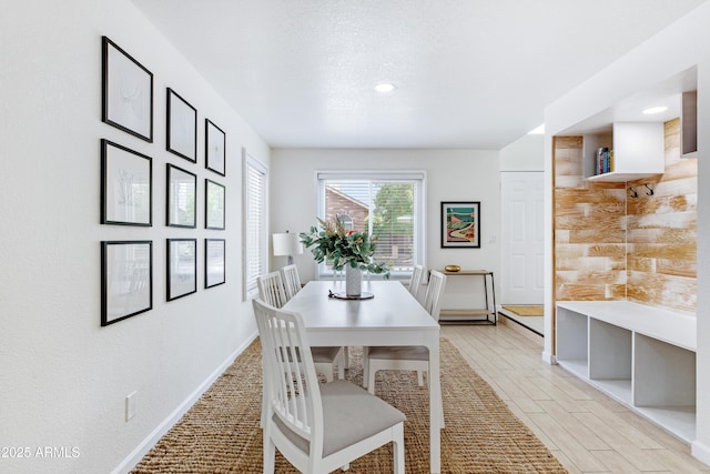 dining space with baseboards and recessed lighting