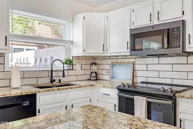 kitchen with a sink, range with electric cooktop, stainless steel microwave, backsplash, and dishwashing machine