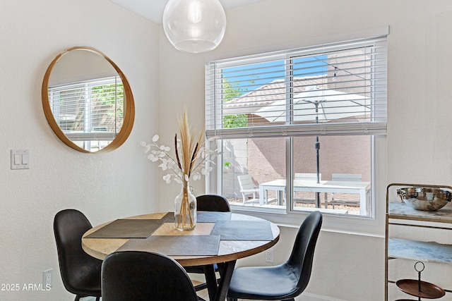 dining area with a textured wall