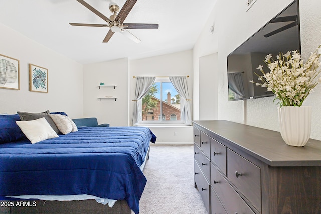 carpeted bedroom featuring a ceiling fan, baseboards, and vaulted ceiling