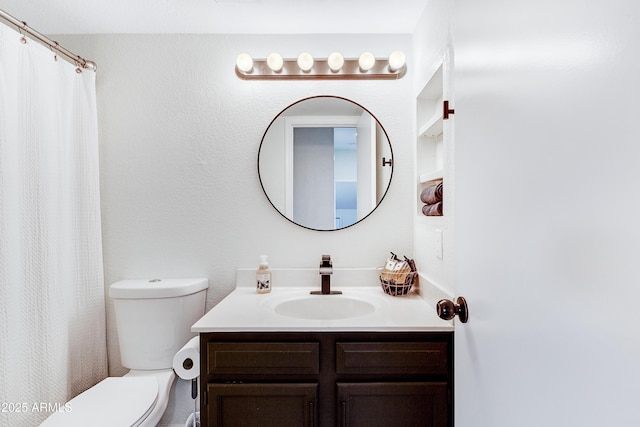 full bath with vanity and toilet