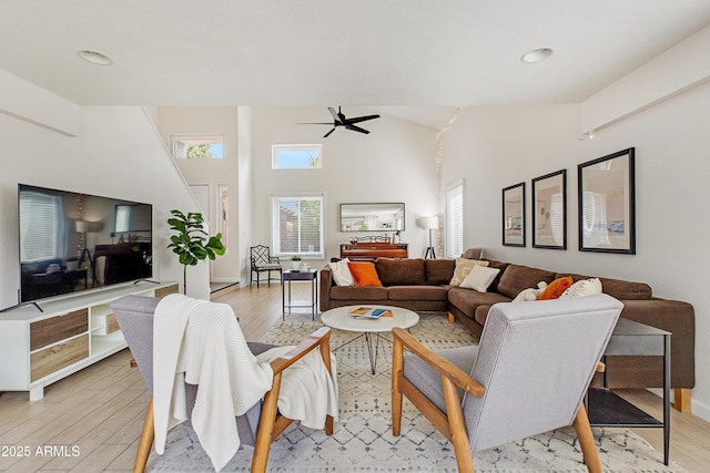 living area with baseboards, ceiling fan, recessed lighting, and light wood-style flooring