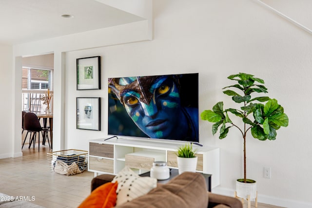 living room featuring baseboards
