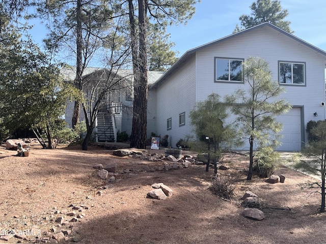 view of side of home featuring a garage