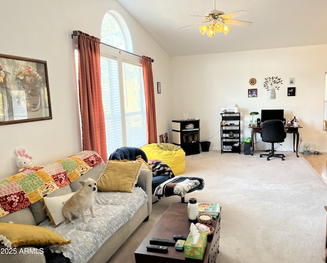 living room featuring lofted ceiling, carpet floors, and ceiling fan