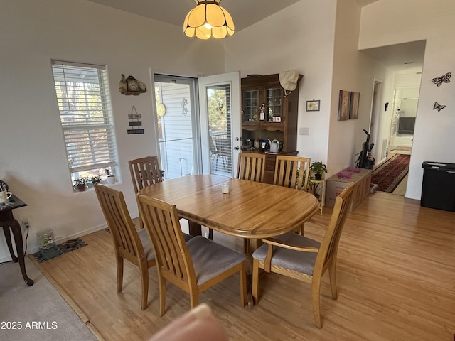 dining space with light wood-type flooring