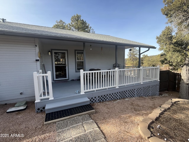 entrance to property featuring a porch