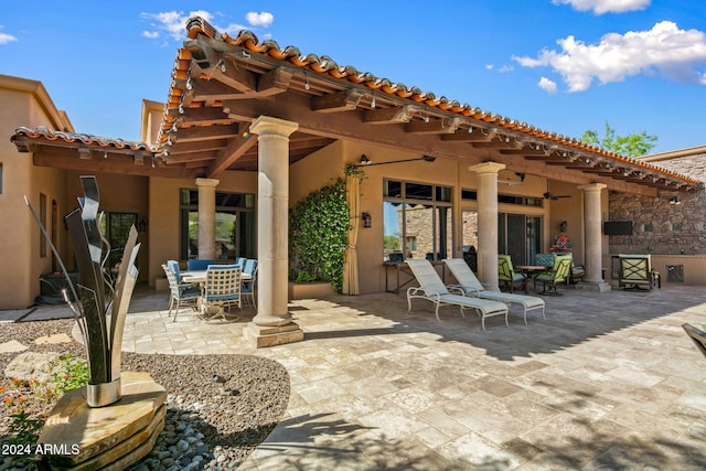 view of patio featuring ceiling fan