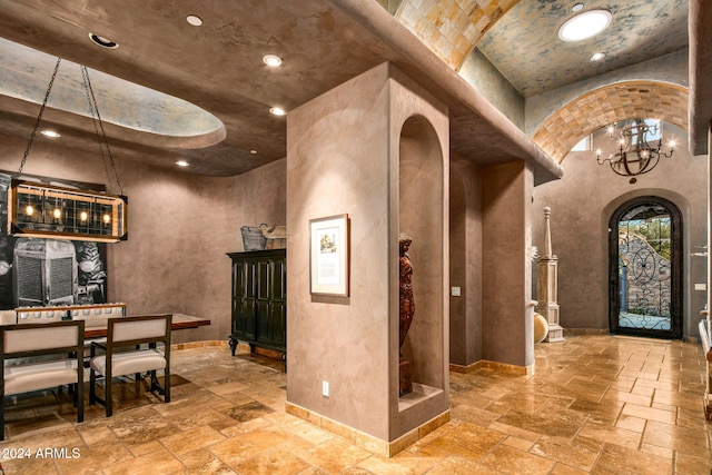 wine cellar with a high ceiling and an inviting chandelier