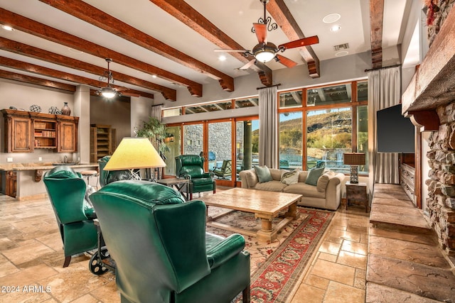 living room with ceiling fan and beam ceiling