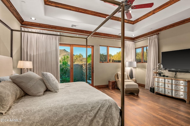 bedroom featuring multiple windows, ceiling fan, and dark hardwood / wood-style floors