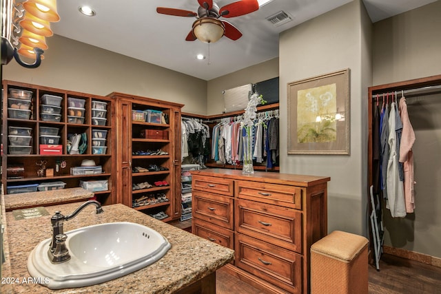 bathroom with ceiling fan, vanity, and hardwood / wood-style flooring