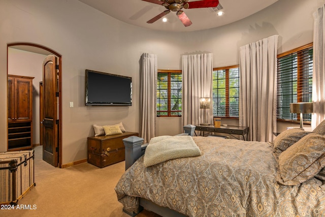 bedroom with light colored carpet and ceiling fan