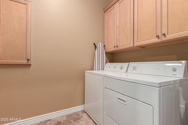 washroom featuring light tile patterned floors, cabinets, and independent washer and dryer