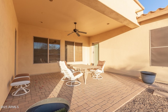 view of patio featuring ceiling fan