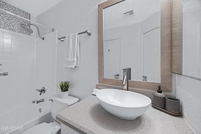 20822 N 34th Dr, Phoenix, AZ 85027 - bathroom featuring vanity, toilet, bathing tub / shower combination, and a textured wall