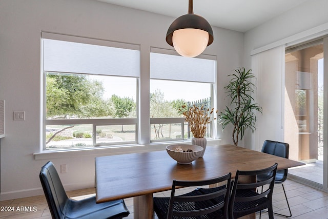 dining space with light hardwood / wood-style floors