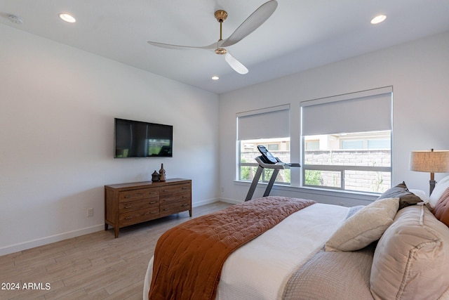 bedroom featuring ceiling fan and light hardwood / wood-style flooring