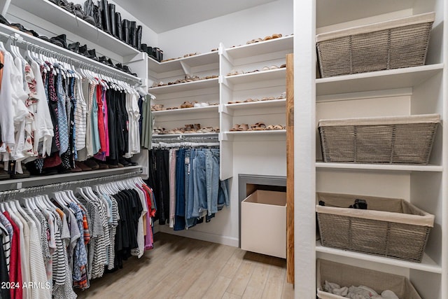 walk in closet featuring light hardwood / wood-style floors