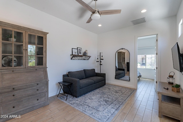 living area featuring ceiling fan