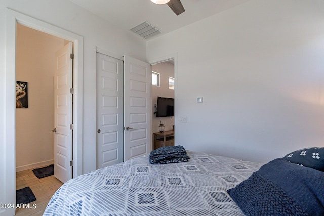 bedroom featuring ceiling fan and light wood-type flooring