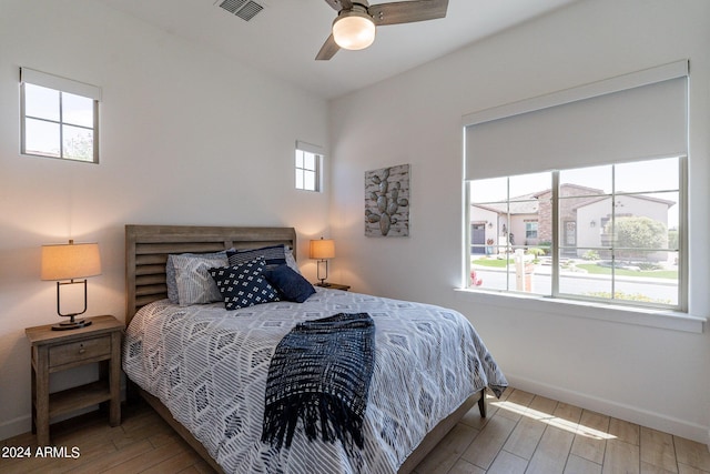 bedroom with wood-type flooring and ceiling fan